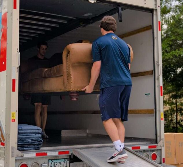 Chris-and-sam-taking-couch-into-truck-7x5-1-1024x705-1
