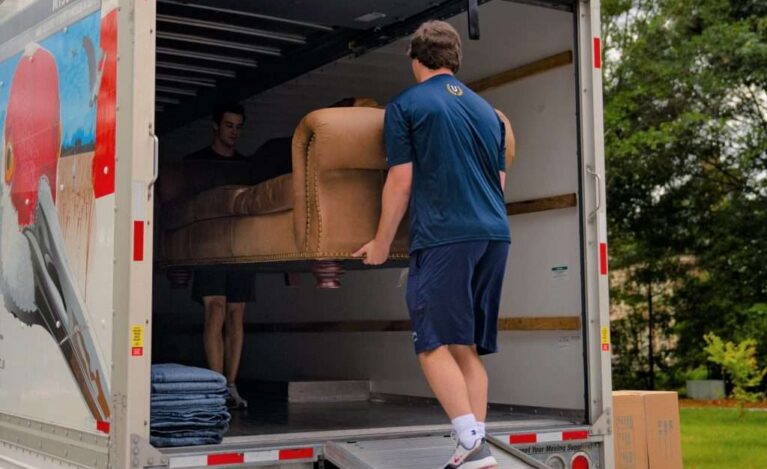 Chris-and-sam-taking-couch-into-truck-7x5-1-1024x705-1